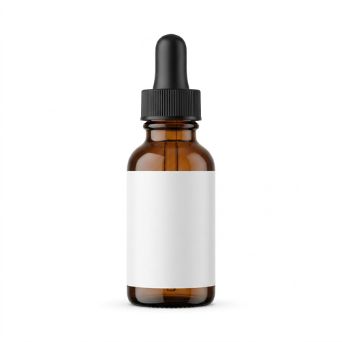 Unbranded amber glass serum bottle with black dropper and blank white label on a white background
