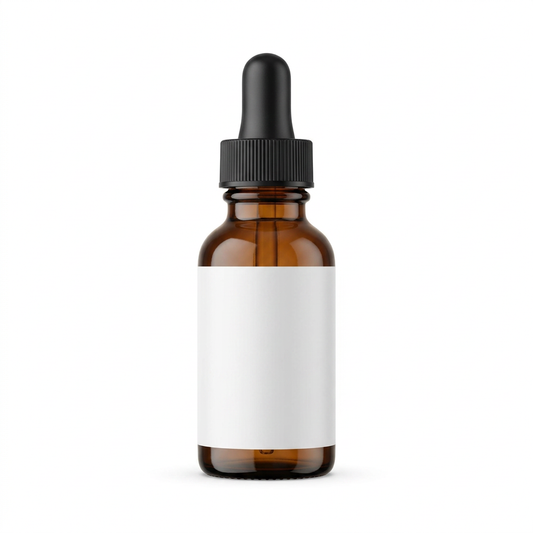 Unbranded amber glass serum bottle with black dropper and blank white label on a white background