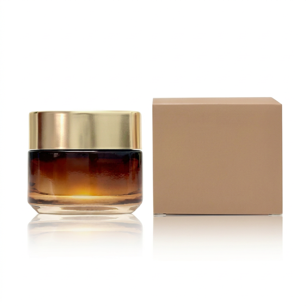 Unbranded amber-gradient face cream jar with gold lid and tan carton on a white background